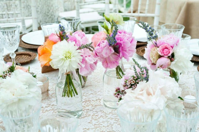 Table setting with colourful flowers